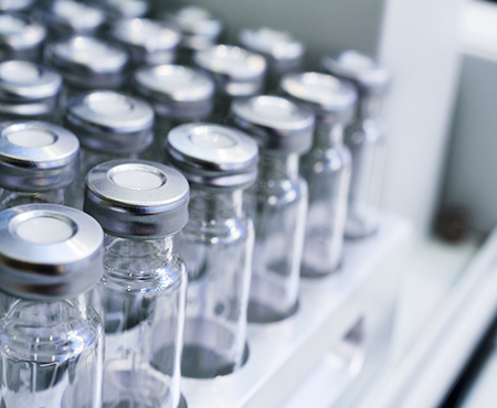 clear pharmaceutical vials stored in tray